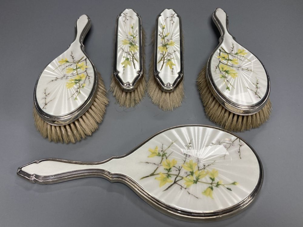 A 1950s silver and enamel five piece mirror and brush set, S.J Rose & Son, London, 1954.